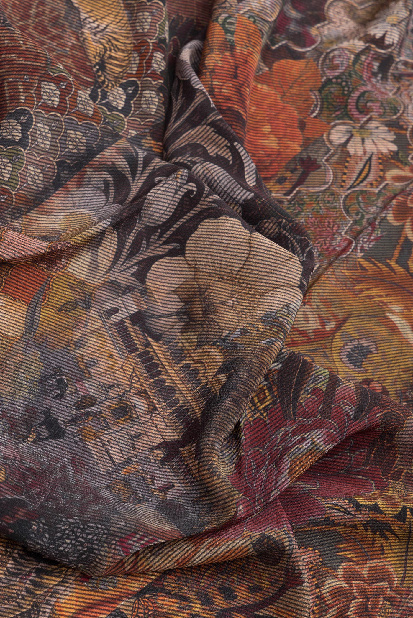 Close up of Black Mysore Crepe Saree with Printed design on the body and Plain Border.  displaying folds