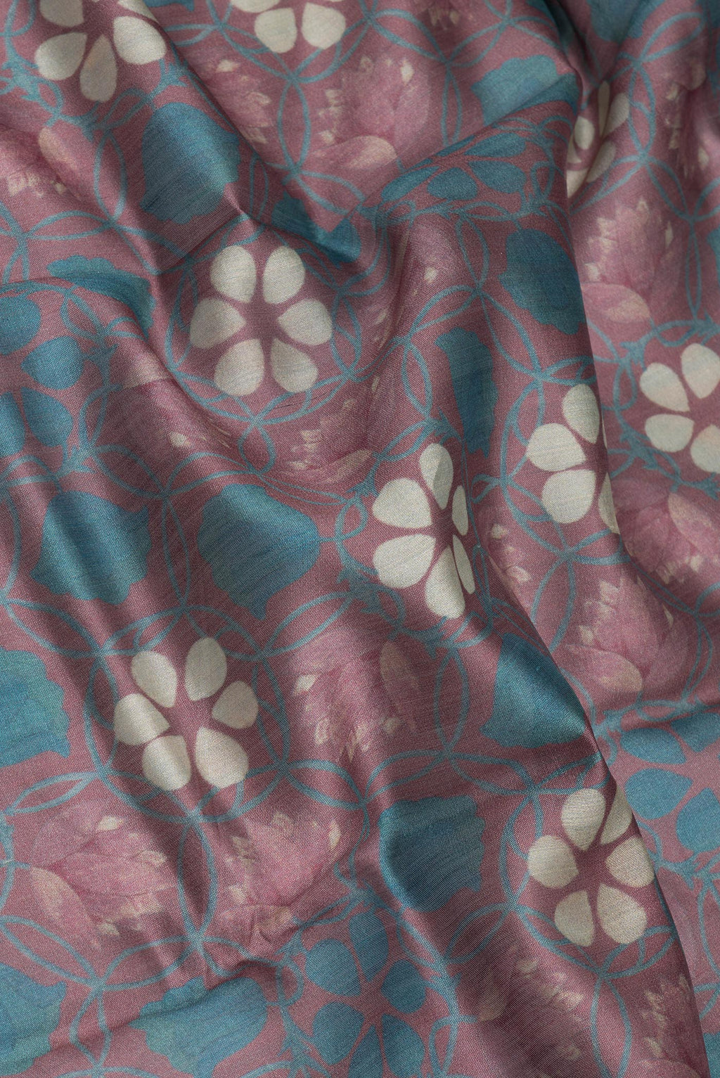 Close up of Mauve Chanderi Silk Cotton Saree with Printed design on the body and Zari Border.  displaying folds