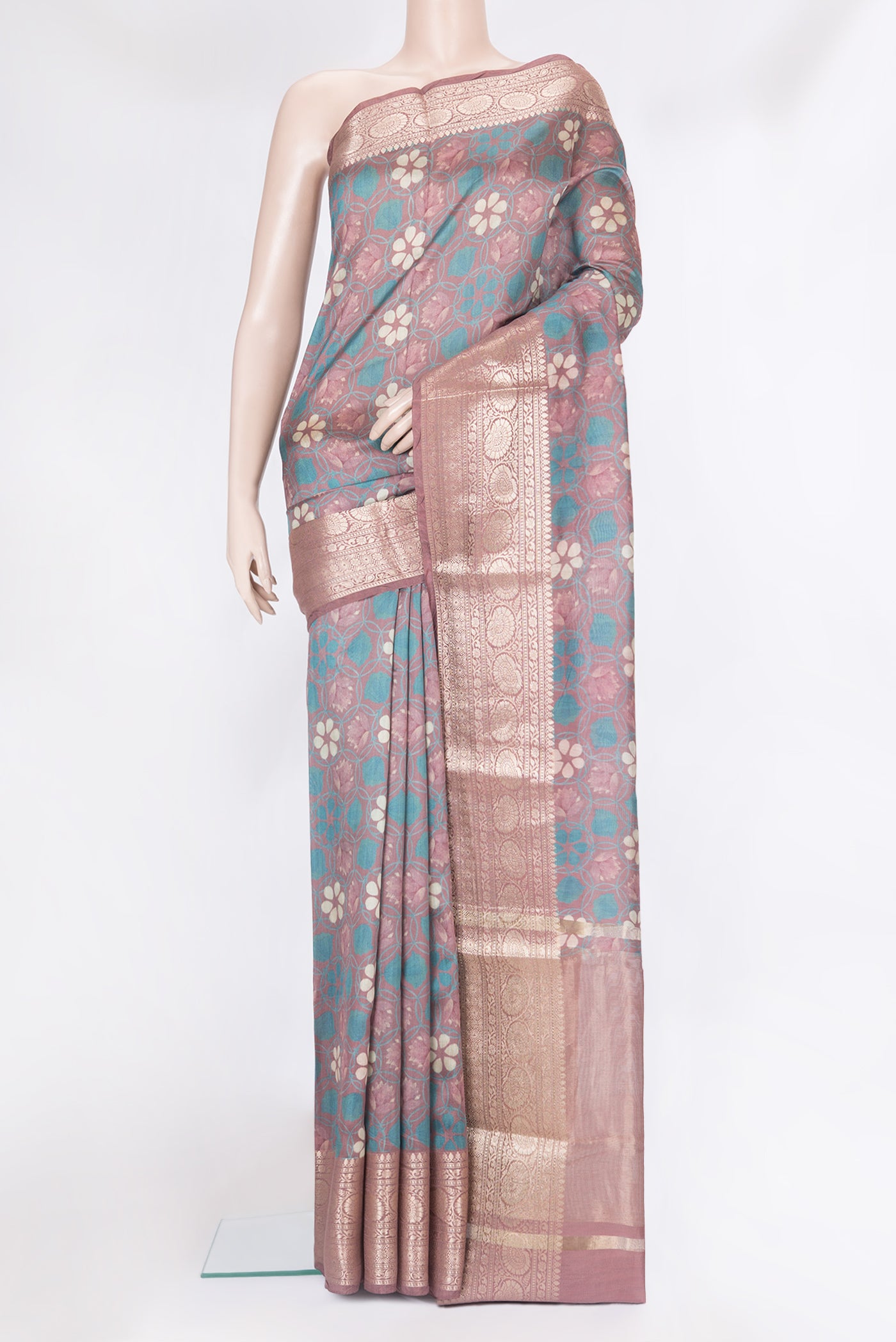 Mauve Chanderi Silk Cotton Saree with Printed design on the body and Zari Border.  displayed on a mannequin