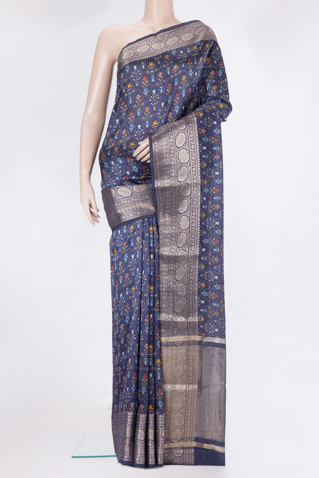 Navy Blue Tussar Silk Saree with Printed design on the body and Zari Border.  displayed on a mannequin
