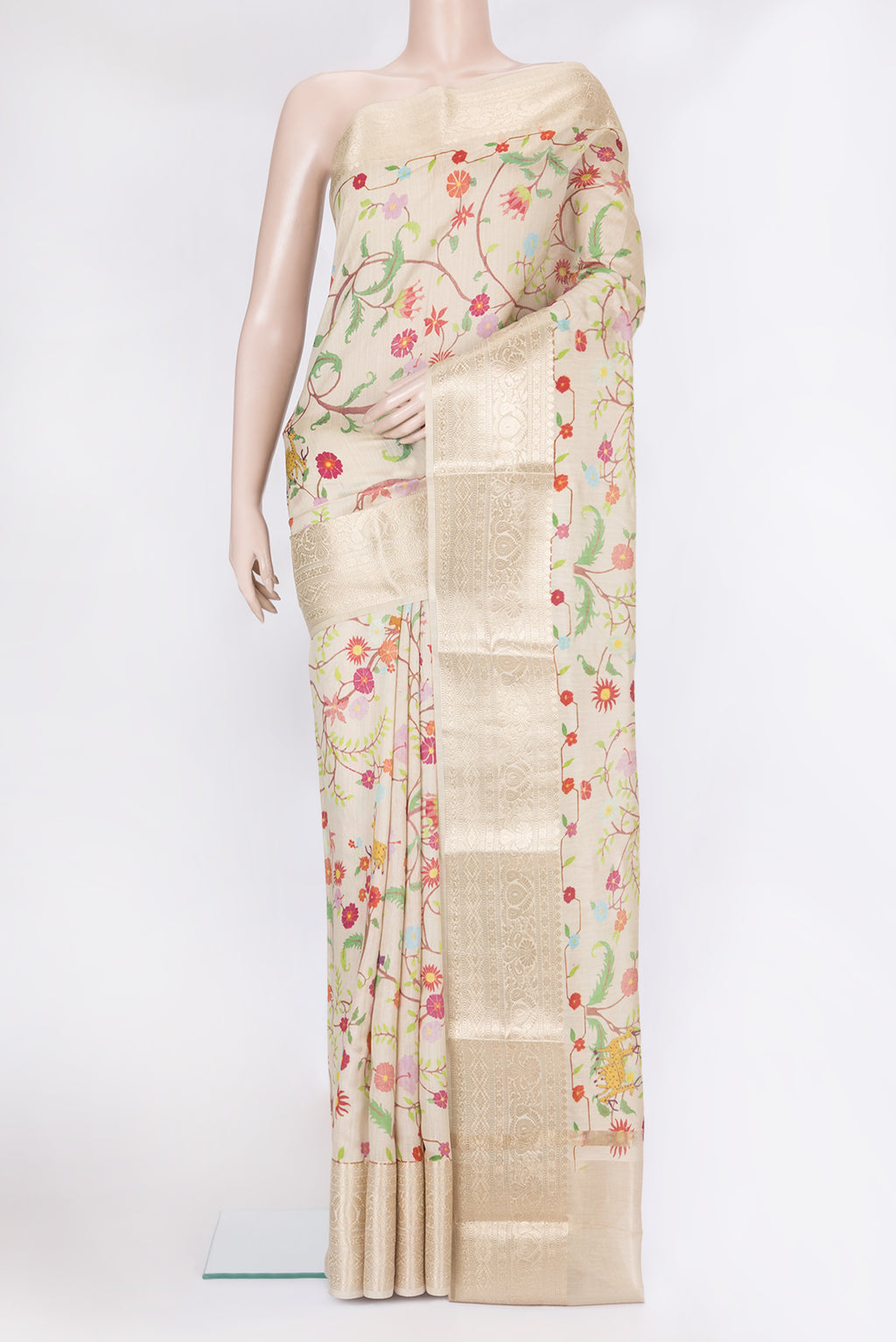 Beige Chanderi Silk Saree with Printed design on the body and Fancy Border.  displayed on a mannequin