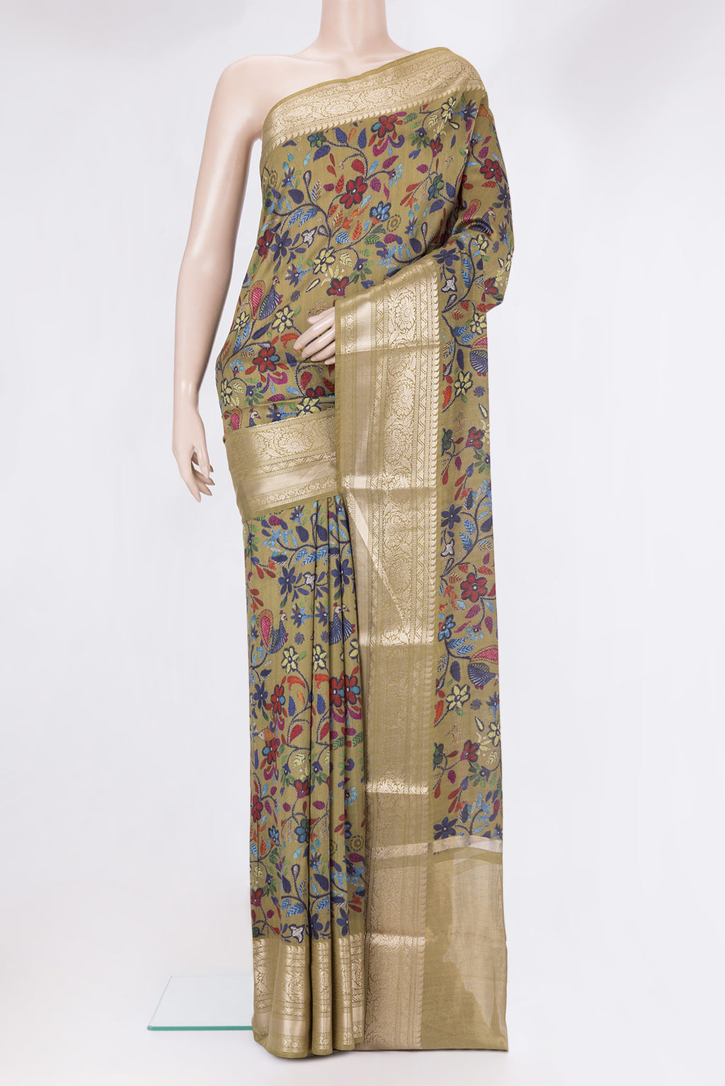Mehandi Green Tussar Silk Saree with Printed design on the body and Zari Border.  displayed on a mannequin