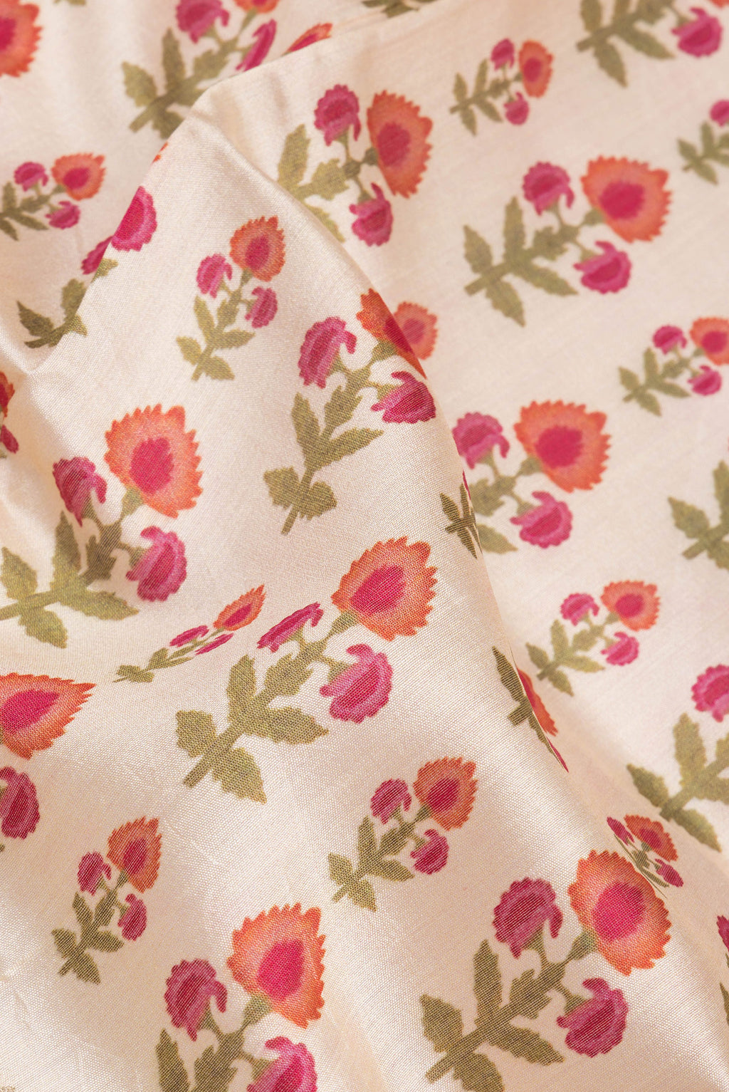 Close up of Beige Chanderi Silk Saree with Printed design on the body and Fancy Border.  displaying folds