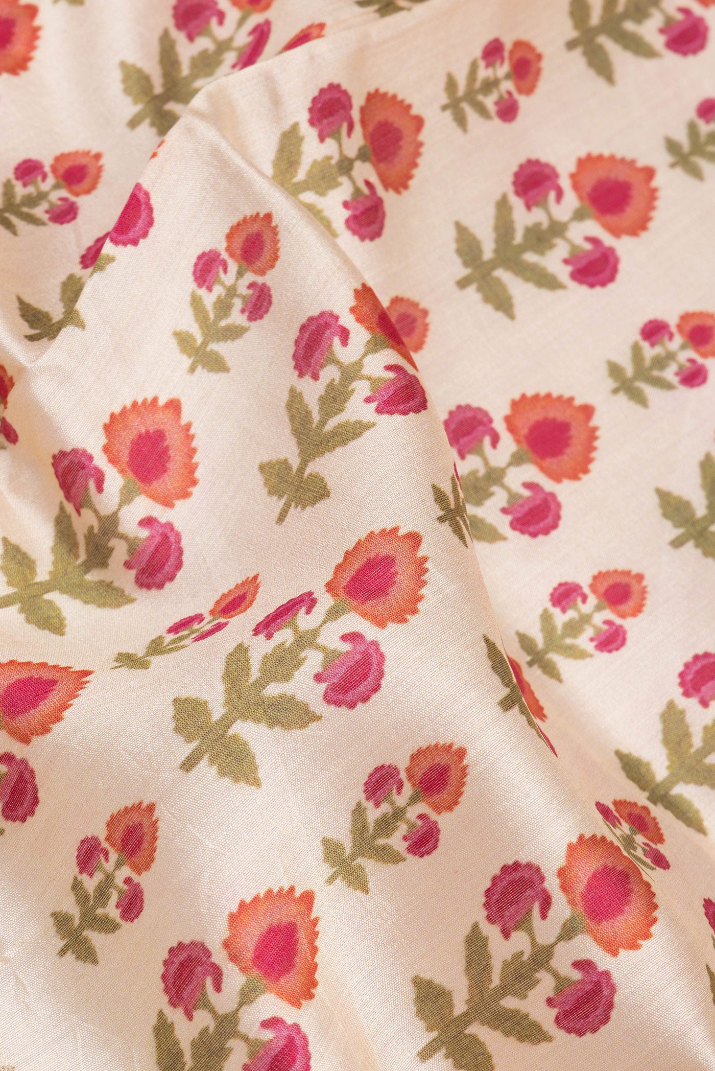 Close up of Beige Chanderi Silk Saree with Printed design on the body and Fancy Border.  displaying folds