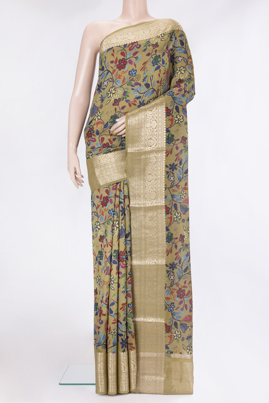 Mehandi Green Tussar Silk Saree with Printed design on the body and Zari Border.  displayed on a mannequin