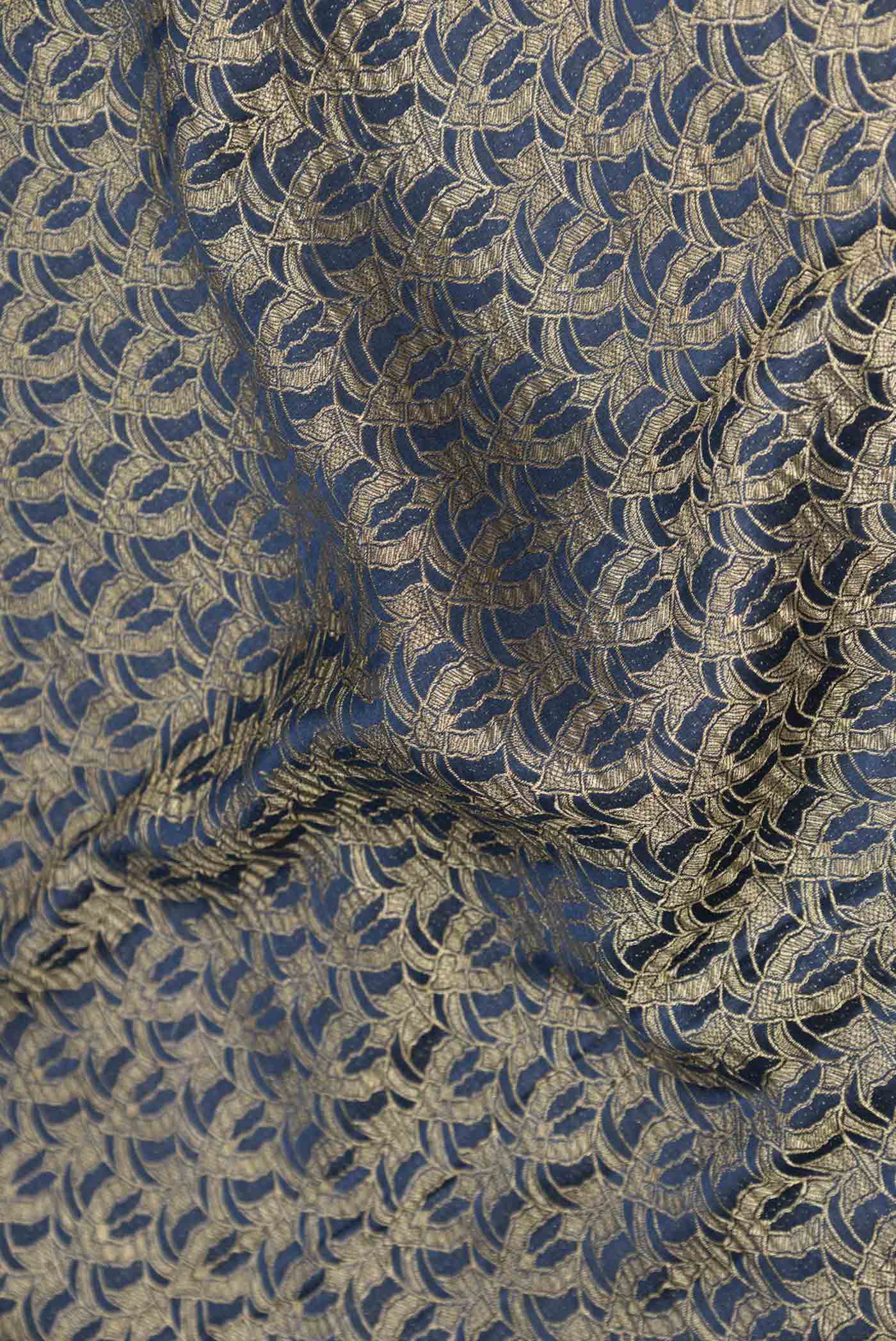 Close up of Navy Blue Dual Tone Mysore Georgette Saree with Zari Brocade on the body and Zari Border displaying folds