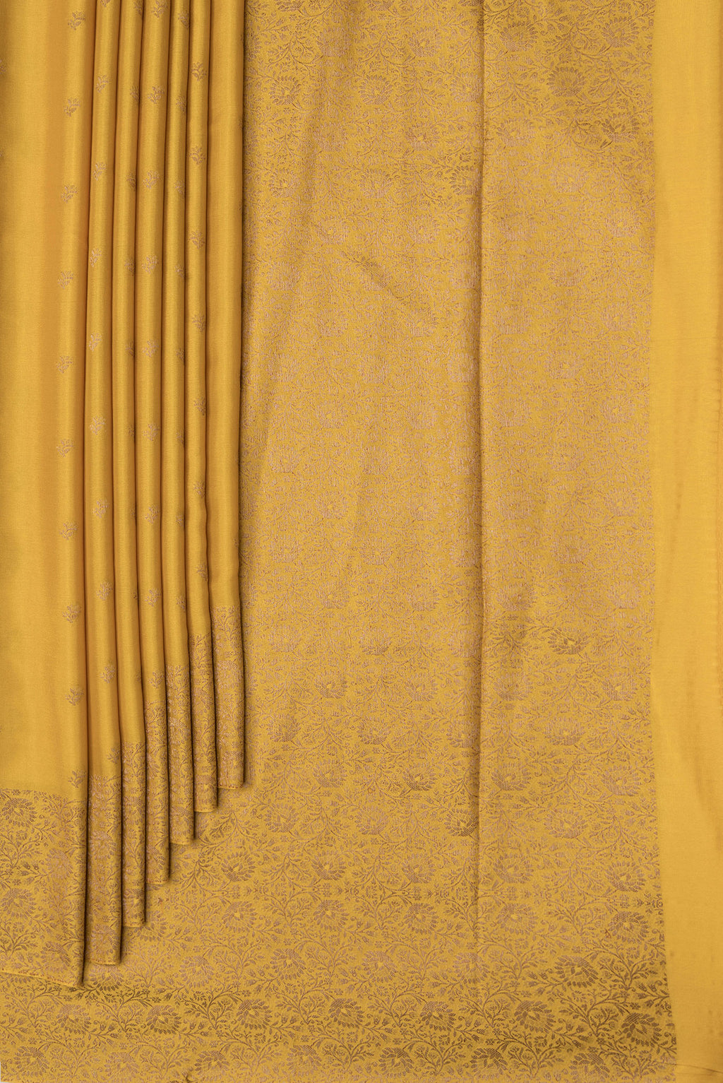 Pleats and pallu of Mustard Dual Tone Mysore Crepe Saree with Zari Butta on the body and Zari Border. 