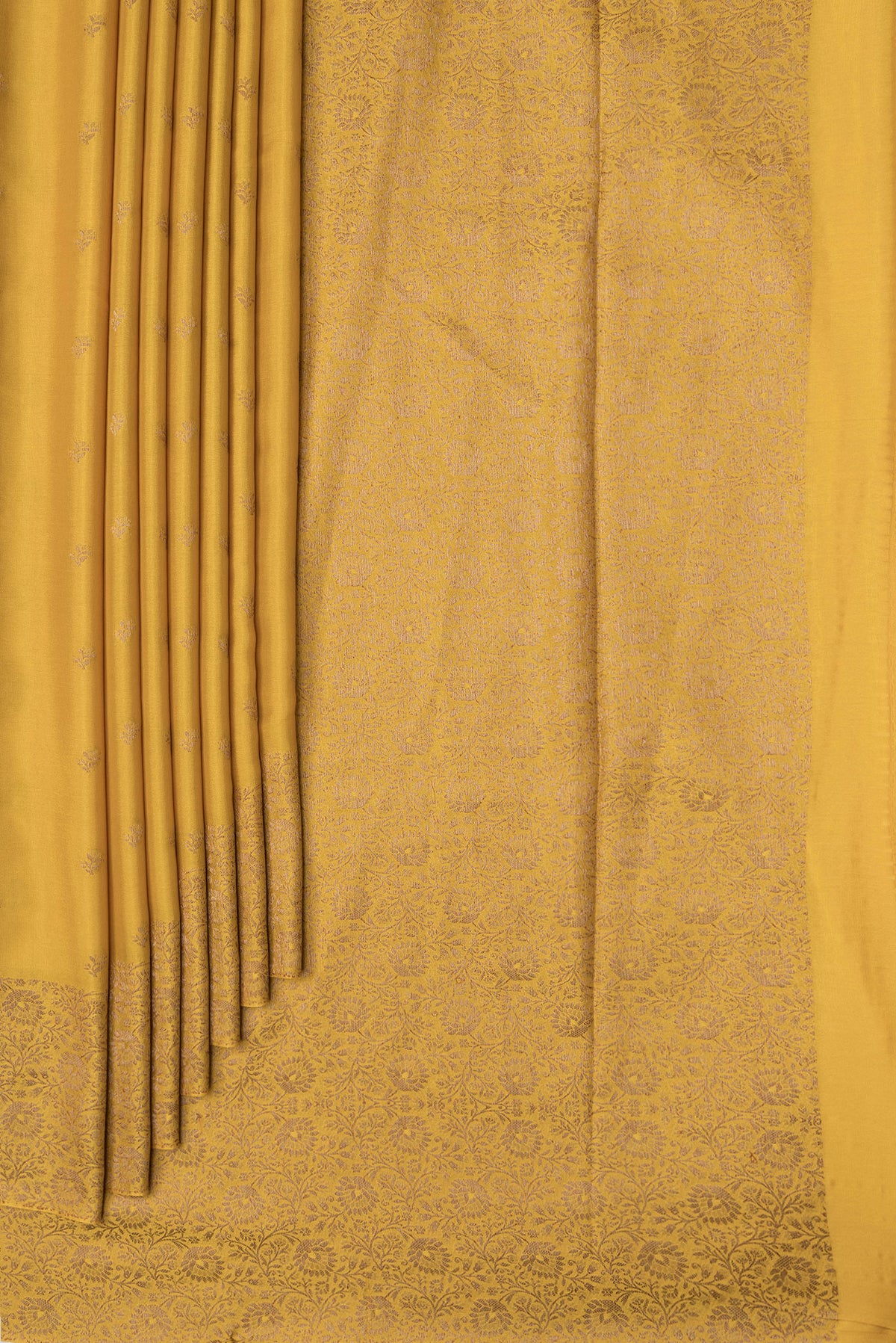 Pleats and pallu of Mustard Dual Tone Mysore Crepe Saree with Zari Butta on the body and Zari Border. 