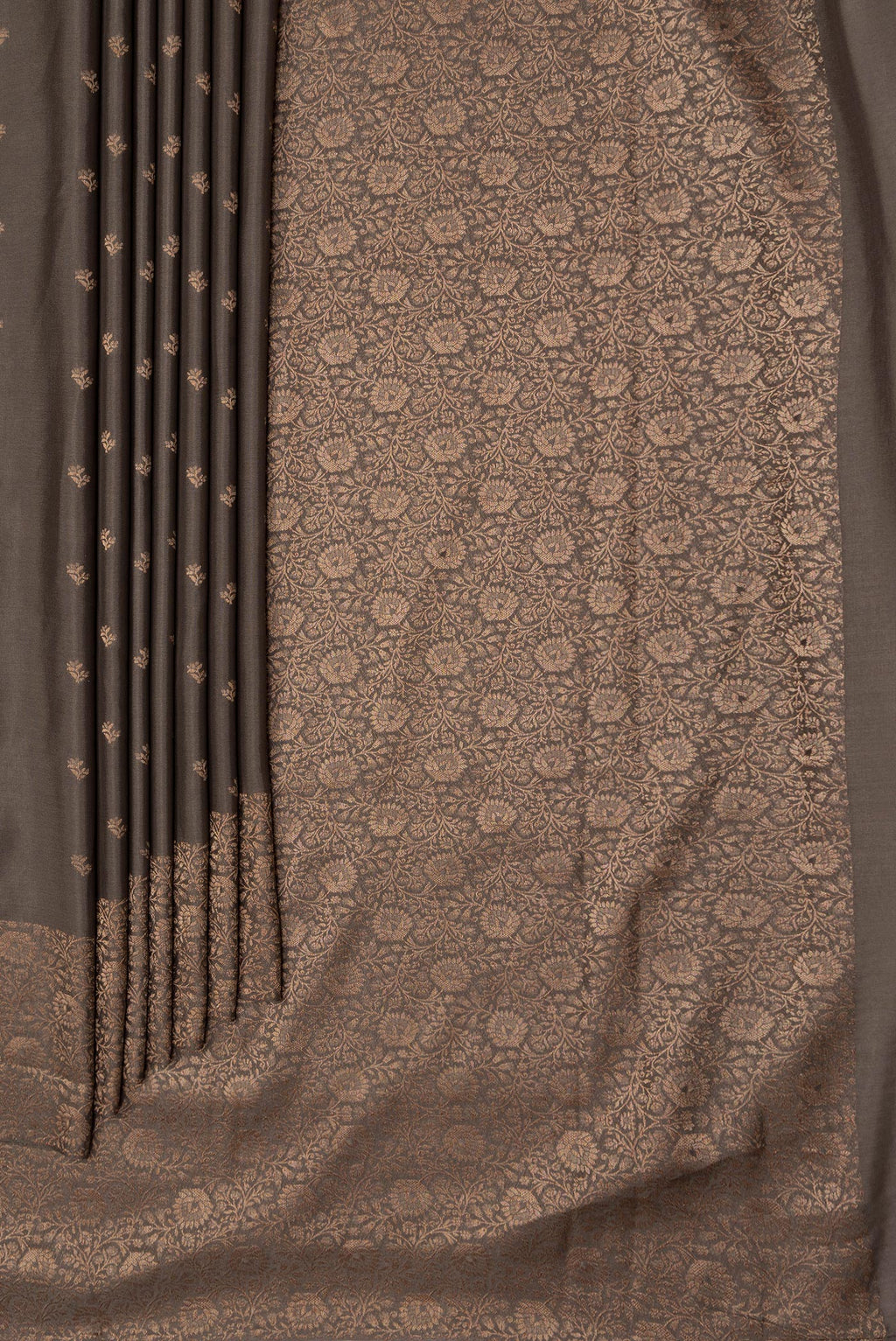 Pleats and pallu of Brown Dual Tone Mysore Crepe Saree with Zari Butta on the body and Zari Border. 