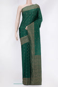 Bottle Green Mysore Crepe Saree with Zari Butta on the body and Zari Border.  displayed on a mannequin