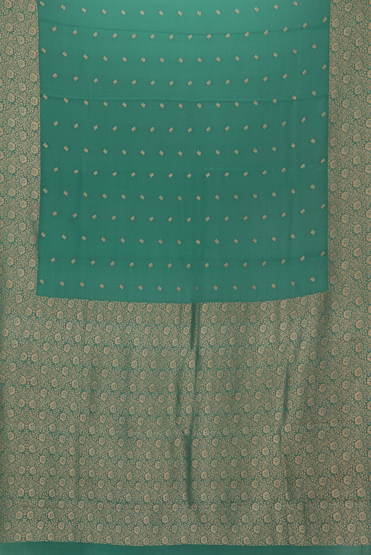 Flat view of Bottle Green Mysore Crepe Saree with Zari Butta on the body and Zari Border. 