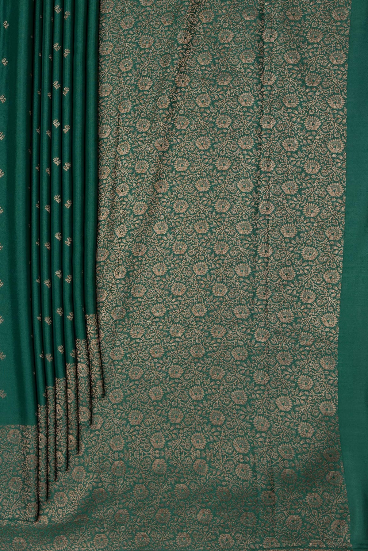 Pleats and pallu of Bottle Green Mysore Crepe Saree with Zari Butta on the body and Zari Border. 