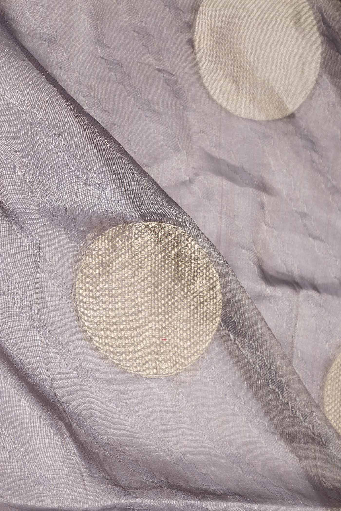 Close up of Grey Dual Tone Mysore Georgette Saree with Zari Brocade on the body and Zari Border displaying folds