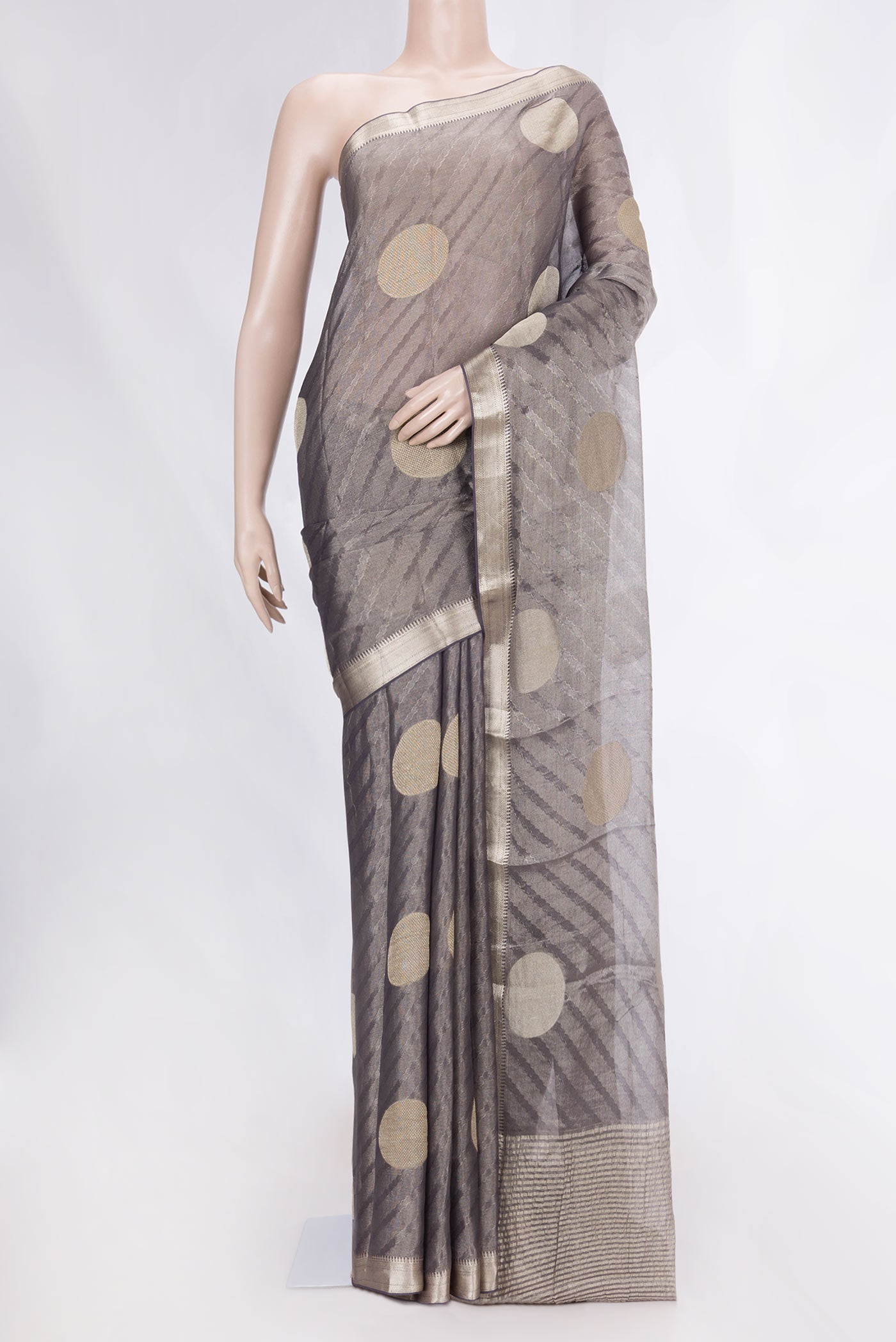 Grey Dual Tone Mysore Georgette Saree with Zari Brocade on the body and Zari Border displayed on a mannequin