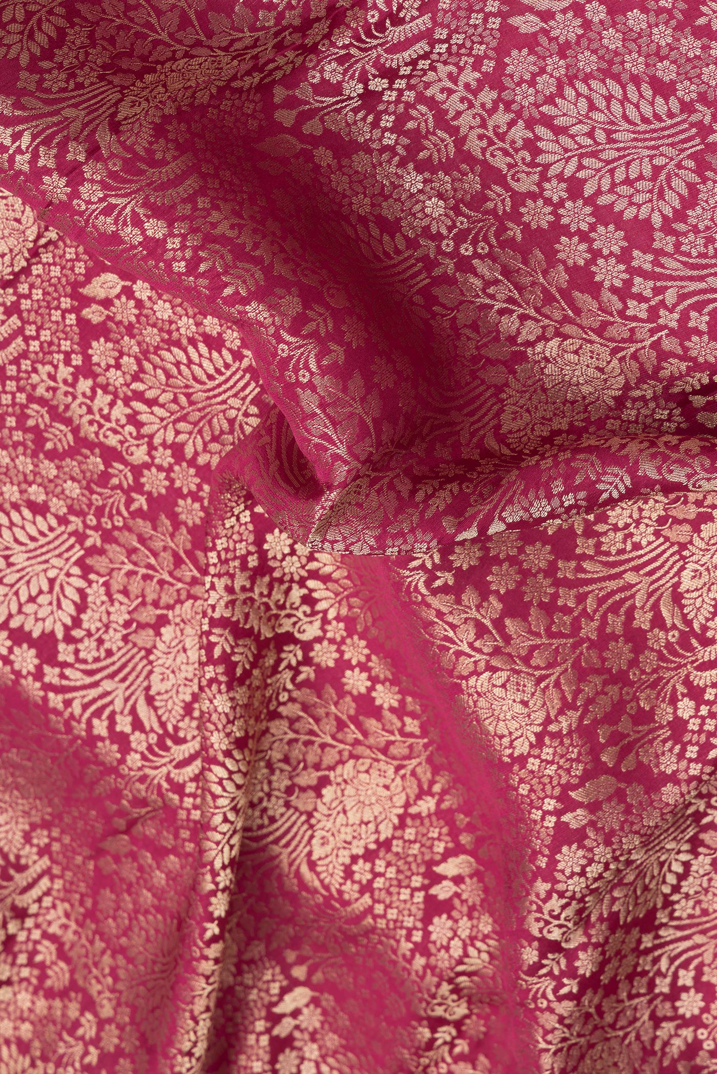 Close up of Pink Mysore Crepe Saree with Zari Brocade on the body and Zari Border.  displaying folds