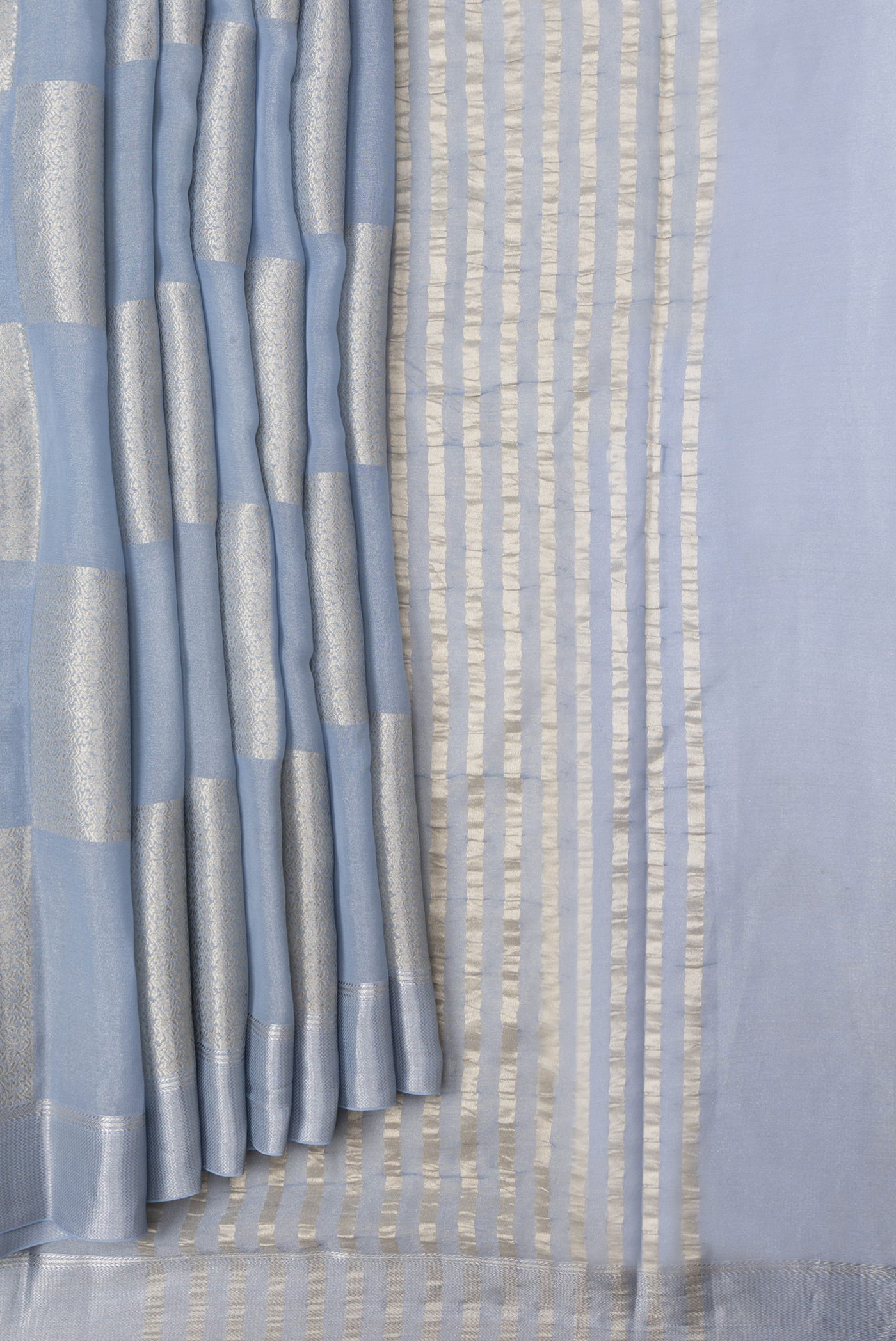 Pleats and pallu of Grey Dual Tone Mysore Georgette Saree with Zari Brocade on the body and Zari Border. 
