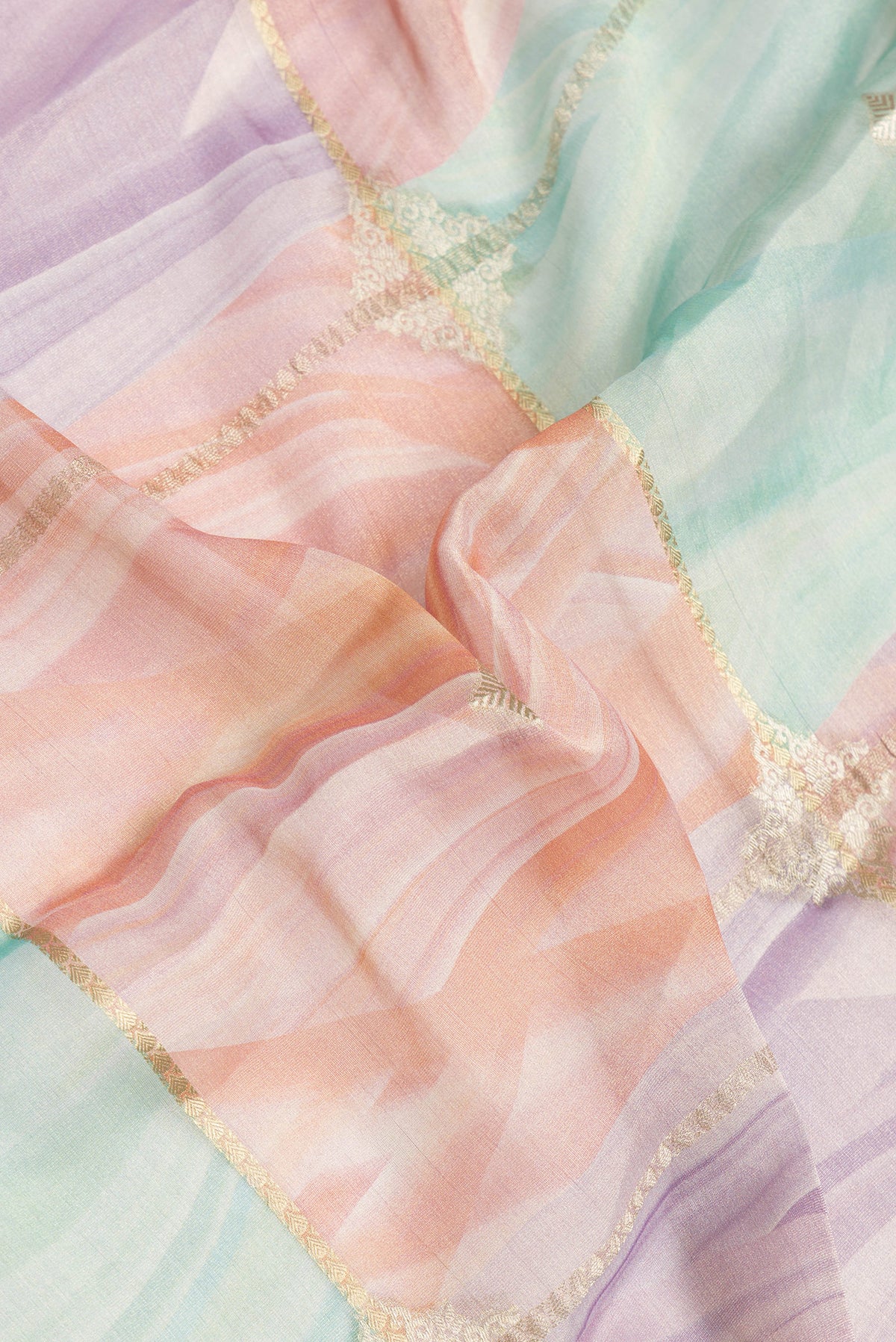 Close up of Lavender Dual Tone Mysore Georgette Saree with Zari Butta on the body and Zari Border.  displaying folds