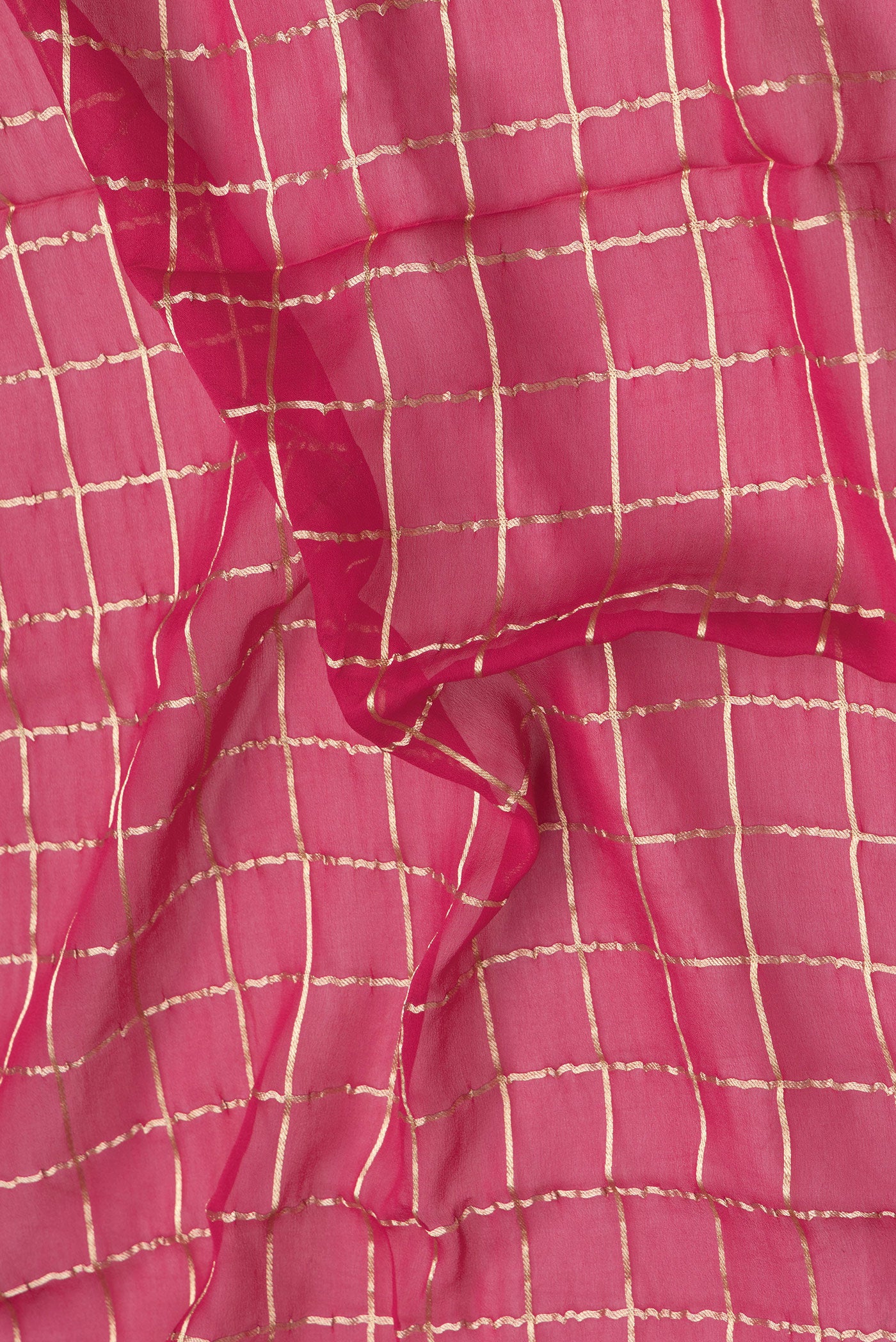 Close up of Pink Dual Tone Mysore Georgette Saree with Checked design on the body and Zari Border.  displaying folds