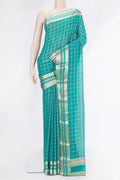 Peacock Blue Dual Tone Mysore Georgette Saree with Checked design on the body and Zari Border.  displayed on a mannequin