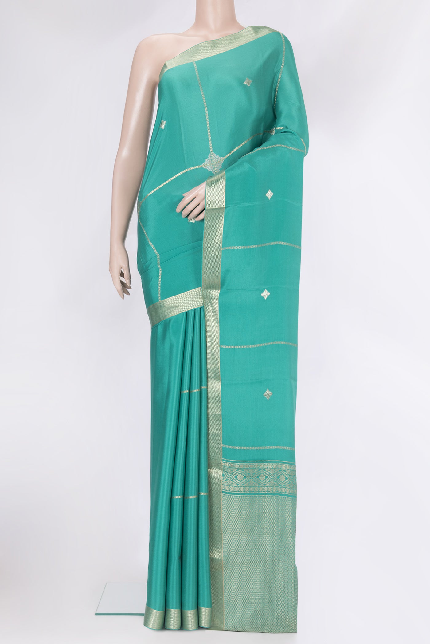 Teal Mysore Silk Saree with Zari Butta on the body and Zari Border.  displayed on a mannequin