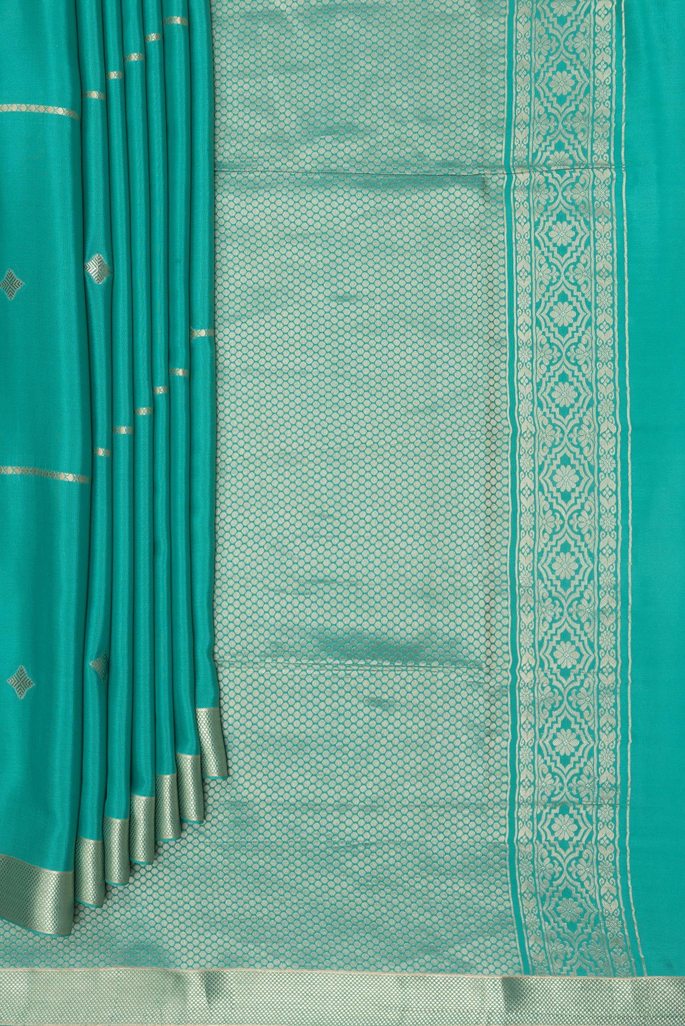 Pleats and pallu of Teal Mysore Silk Saree with Zari Butta on the body and Zari Border. 