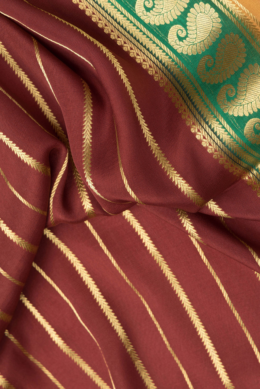 Close up of Maroon Dual Tone Mysore Silk Saree with Stripes on the body and Zari Border.  displaying folds