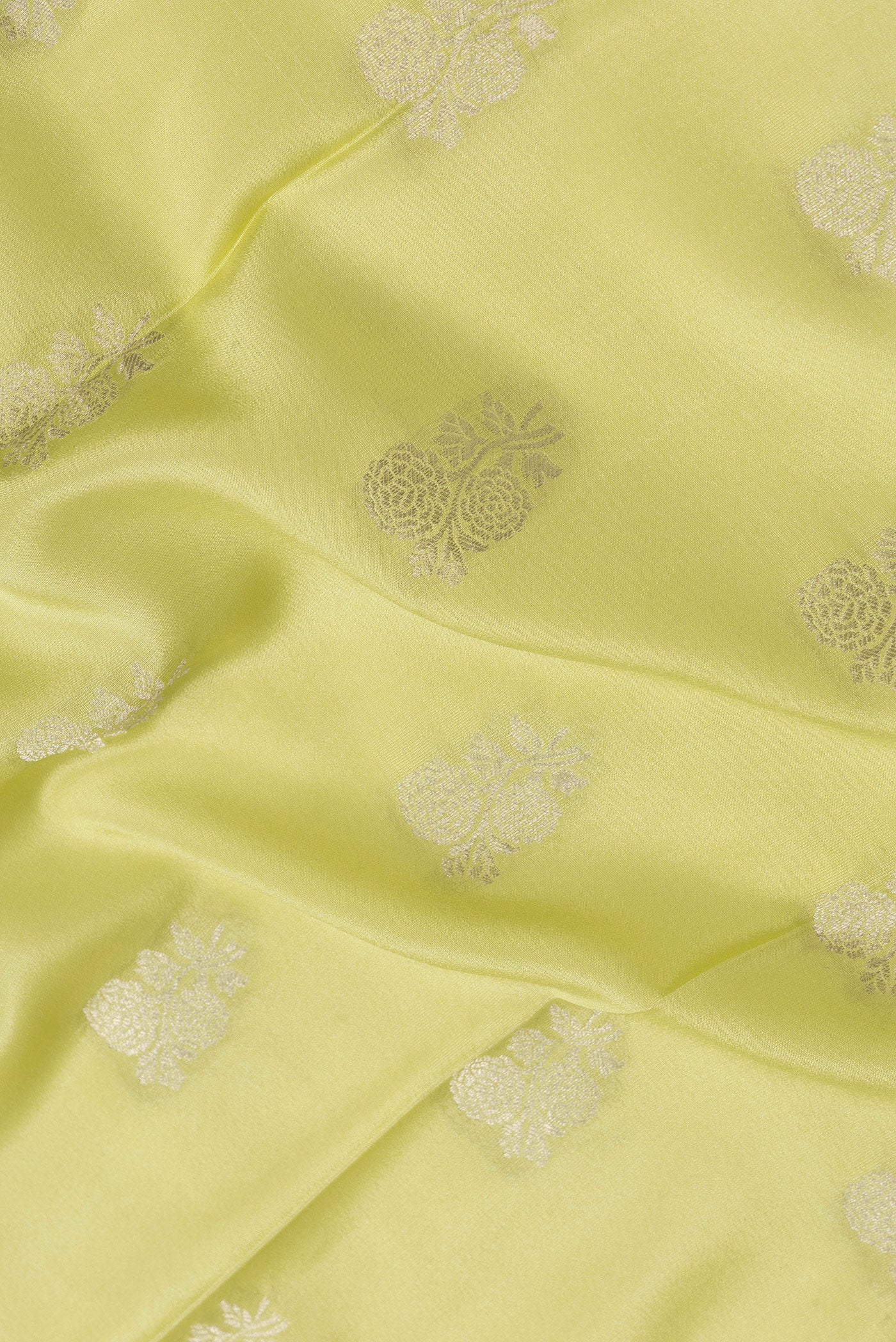 Close up of Pista Green Dual Tone Mysore Silk Saree with Zari Butta on the body and Zari Border.  displaying folds