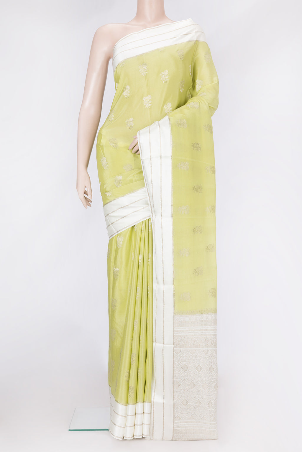 Pista Green Dual Tone Mysore Silk Saree with Zari Butta on the body and Zari Border.  displayed on a mannequin