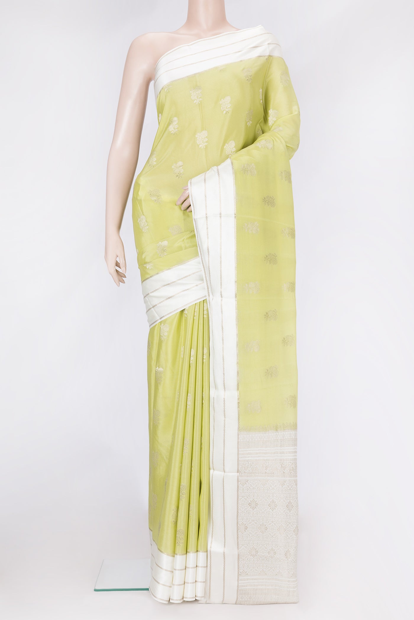 Pista Green Dual Tone Mysore Silk Saree with Zari Butta on the body and Zari Border.  displayed on a mannequin
