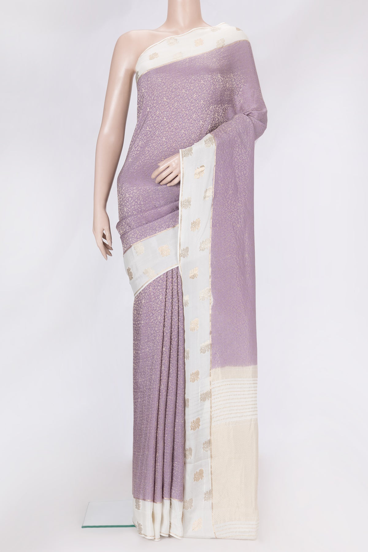 Lavender Dual Tone Georgette Saree with Zari Brocade on the body and Fancy Border.  displayed on a mannequin