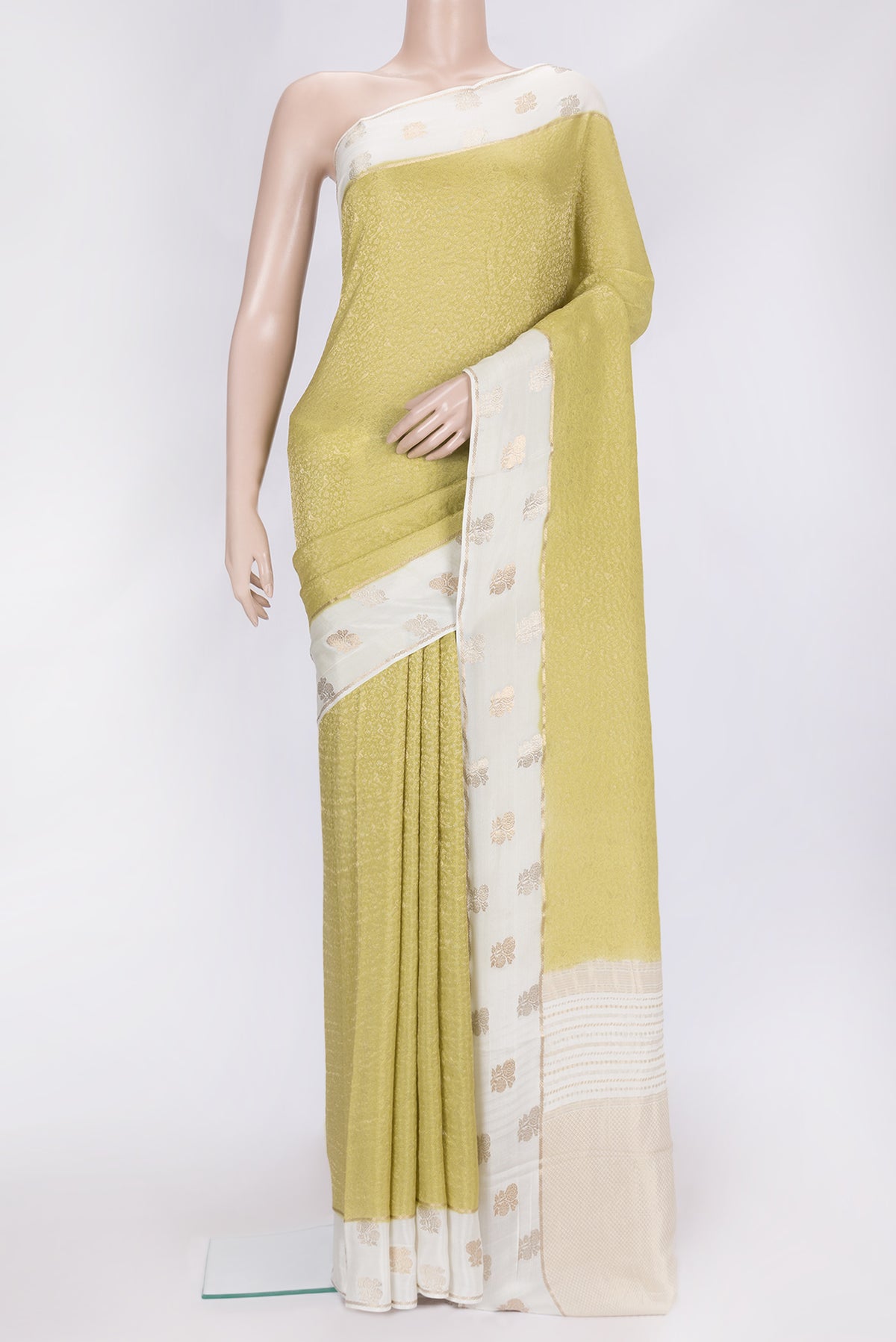 Pista Green Dual Tone Mysore Georgette Saree with Zari Brocade on the body and Fancy Border.  displayed on a mannequin