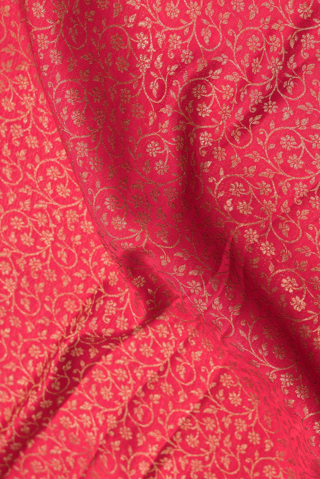 Close up of Pink Dual Tone Banarasi Silk Saree with Zari Brocade on the body and Zari Border.  displaying folds