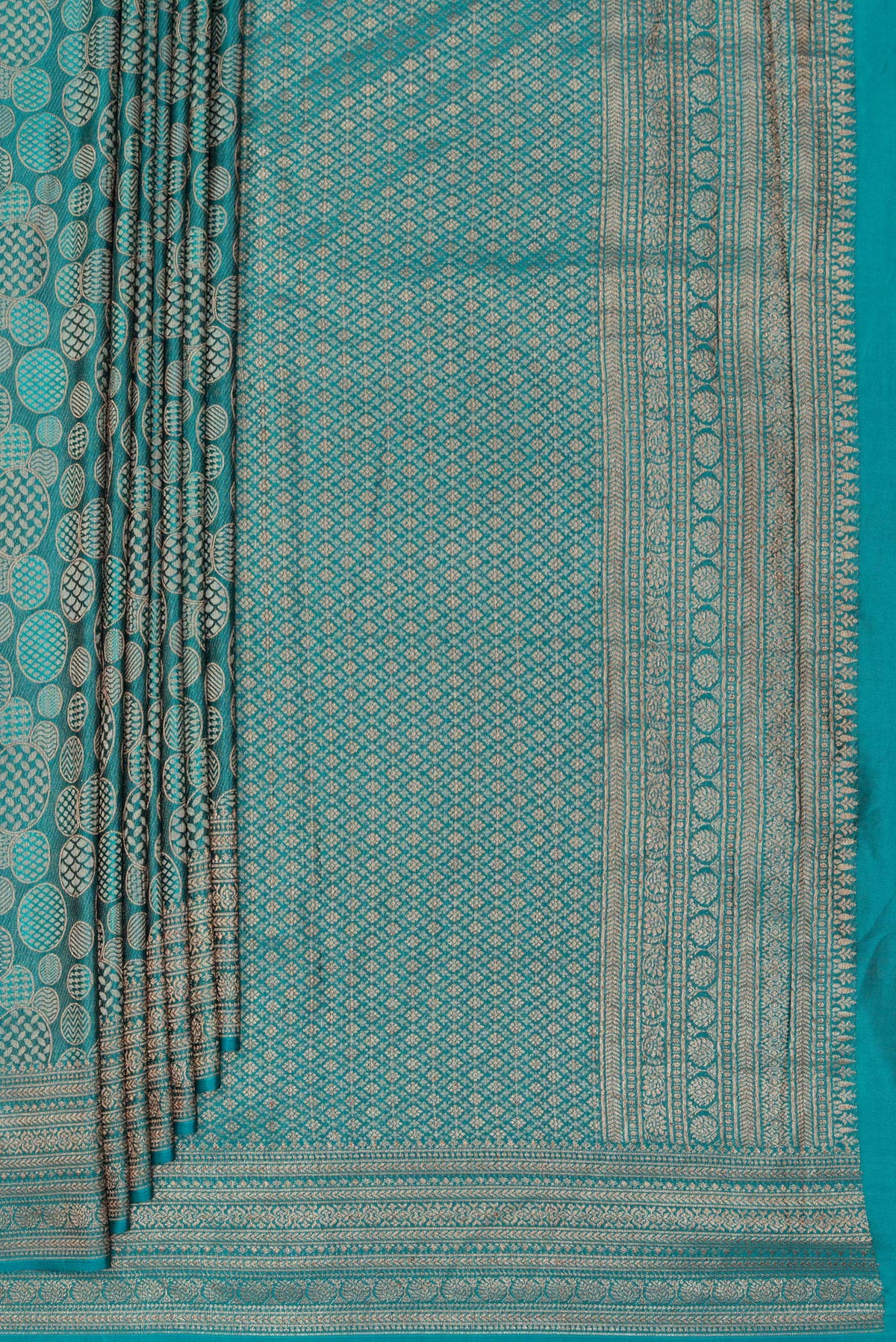 Pleats and pallu of Teal Crepe Saree with Zari Brocade on the body and Zari Border. 