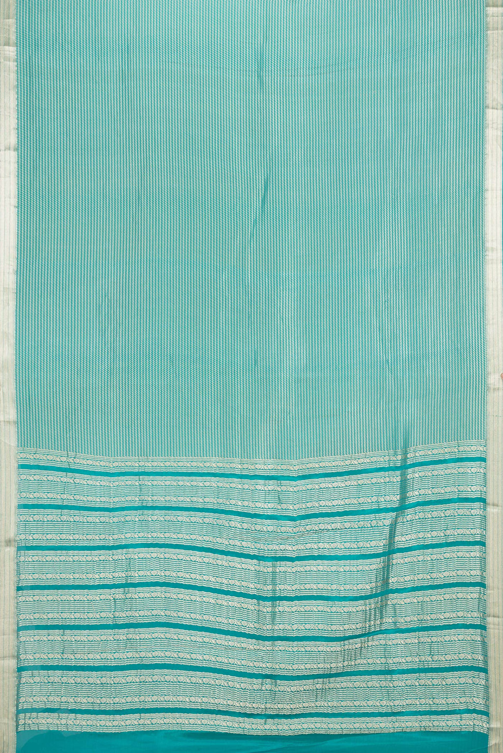 Flat view of Sky Blue Dual Tone Banarasi Georgette Saree with Zari Brocade on the body and Zari Border. 