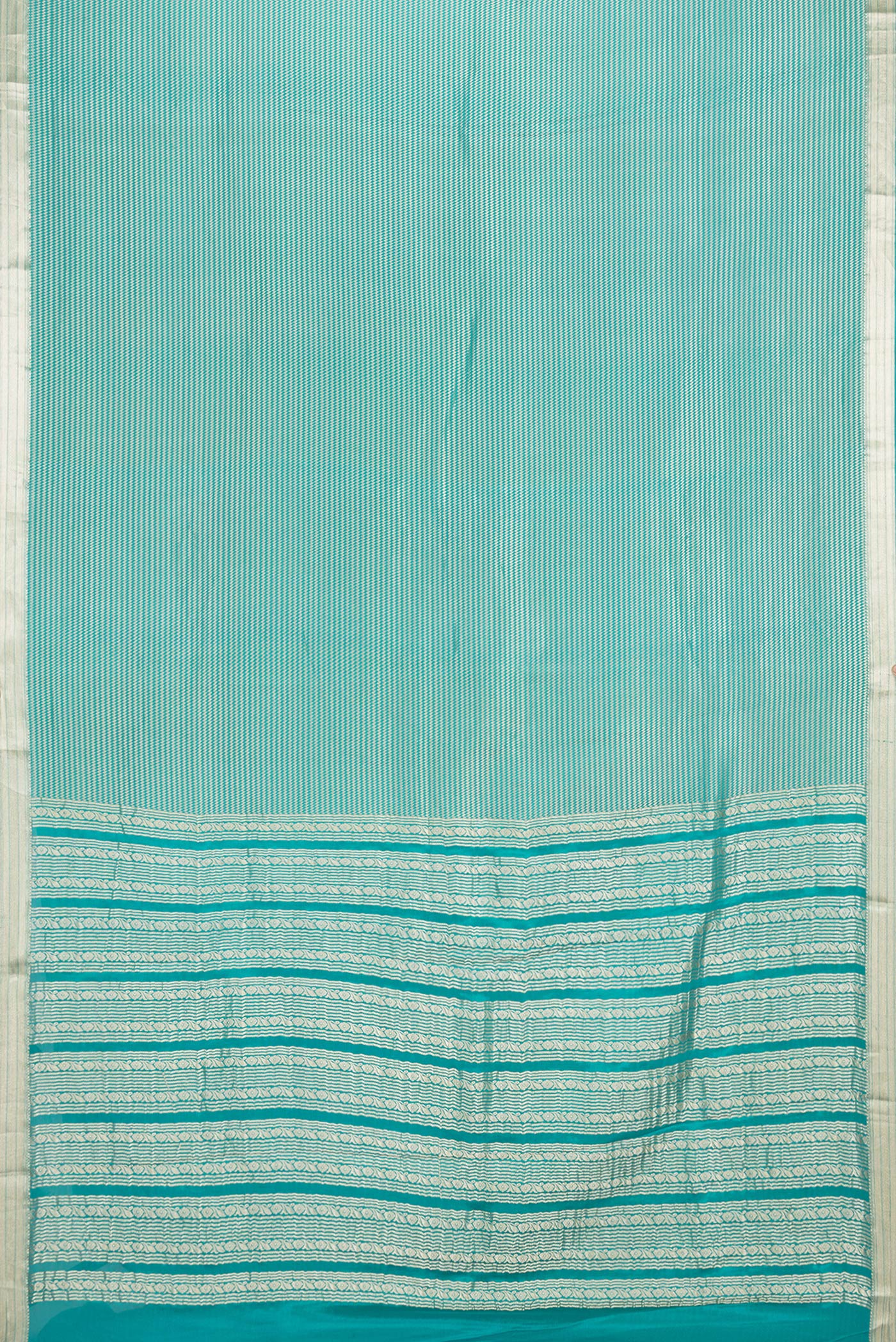 Flat view of Sky Blue Dual Tone Banarasi Georgette Saree with Zari Brocade on the body and Zari Border. 
