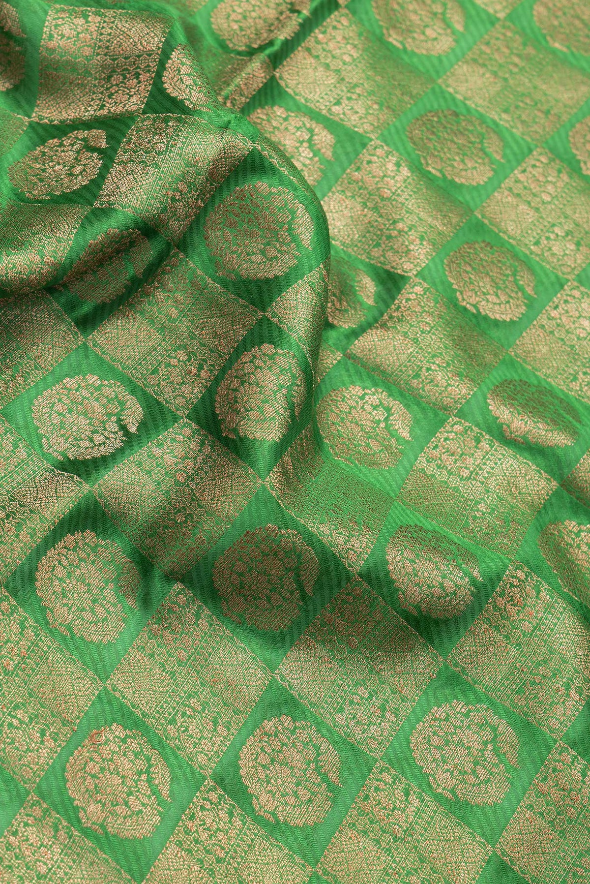 Close up of Bottle Green Dual Tone Banarasi Georgette Saree with Zari Brocade on the body and Zari Border.  displaying folds