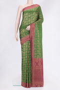 Bottle Green Dual Tone Banarasi Georgette Saree with Zari Brocade on the body and Zari Border.  displayed on a mannequin