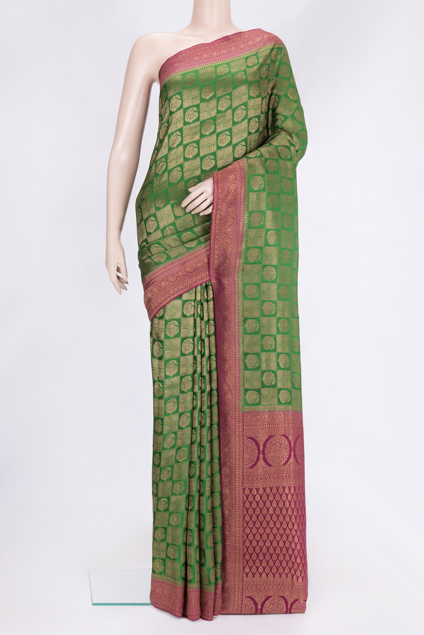 Bottle Green Dual Tone Banarasi Georgette Saree with Zari Brocade on the body and Zari Border.  displayed on a mannequin