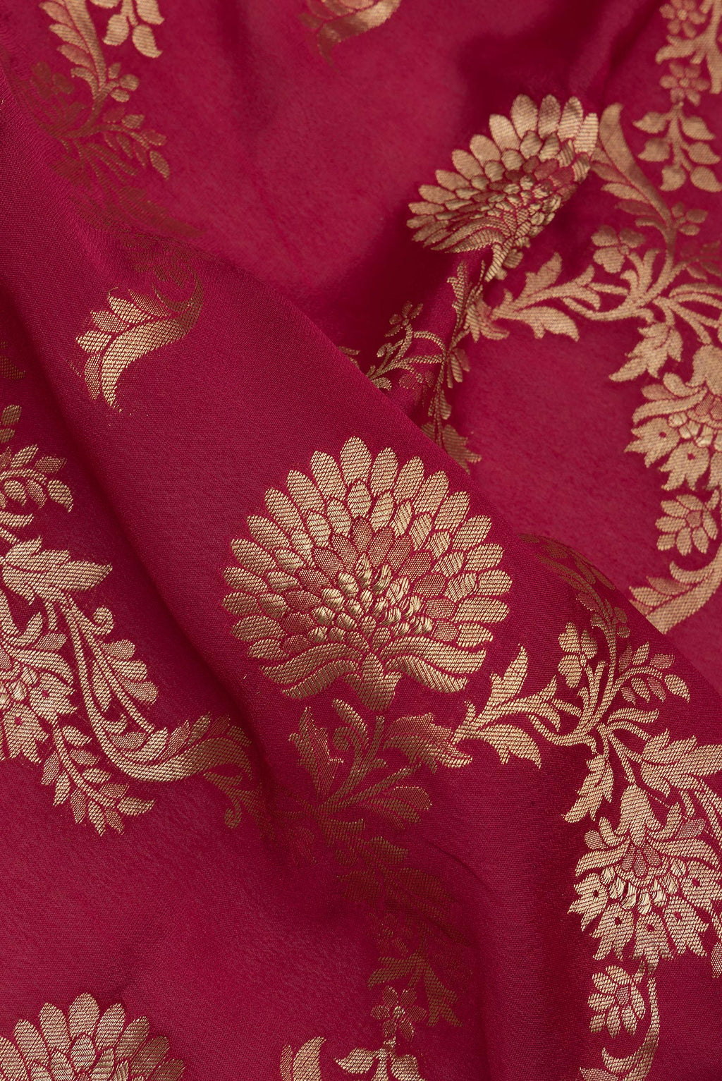 Close up of Deep Red Crepe Saree with Zari Brocade on the body and Zari Border.  displaying folds
