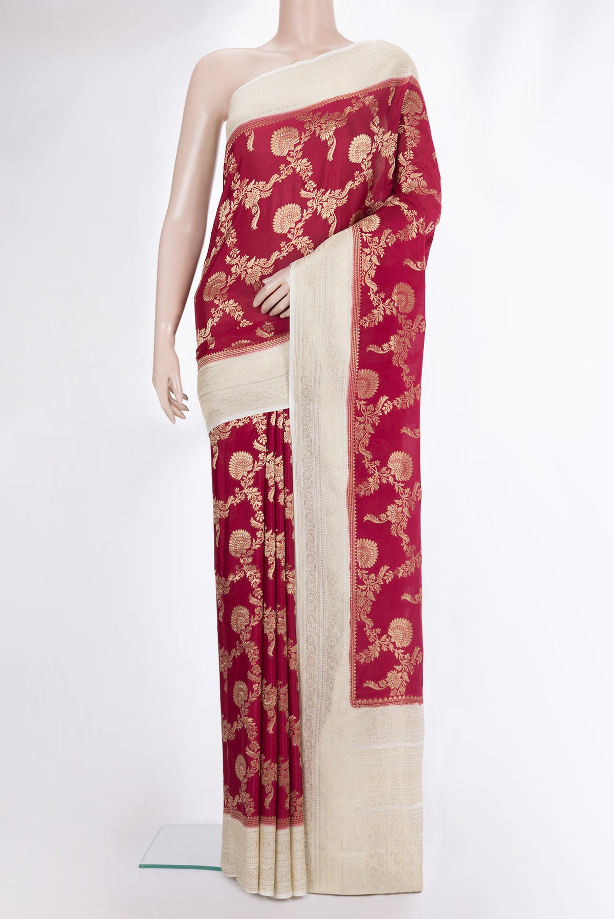 Deep Red Crepe Saree with Zari Brocade on the body and Zari Border.  displayed on a mannequin