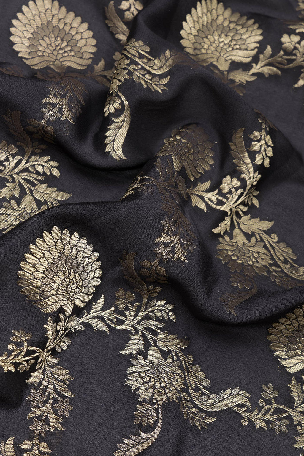 Close up of Black Banarasi Georgette Saree with Zari Brocade on the body and Zari Border.  displaying folds