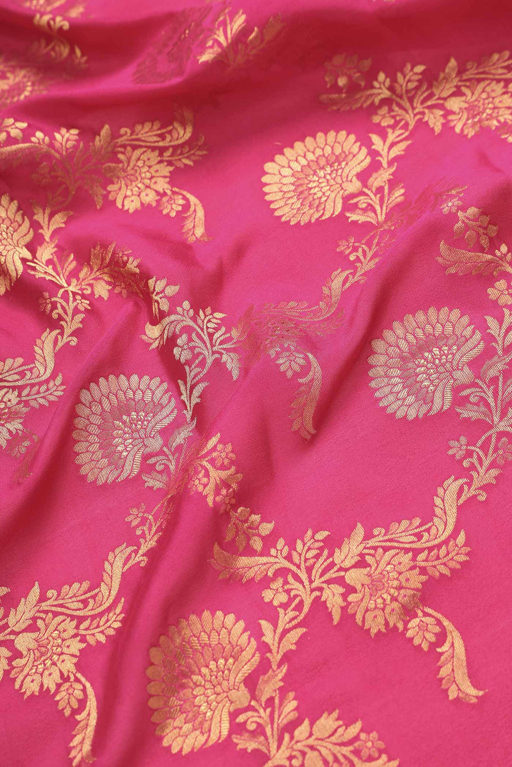 Close up of Pink Dual Tone Banarasi Georgette Saree with Zari Brocade on the body and Zari Border.  displaying folds