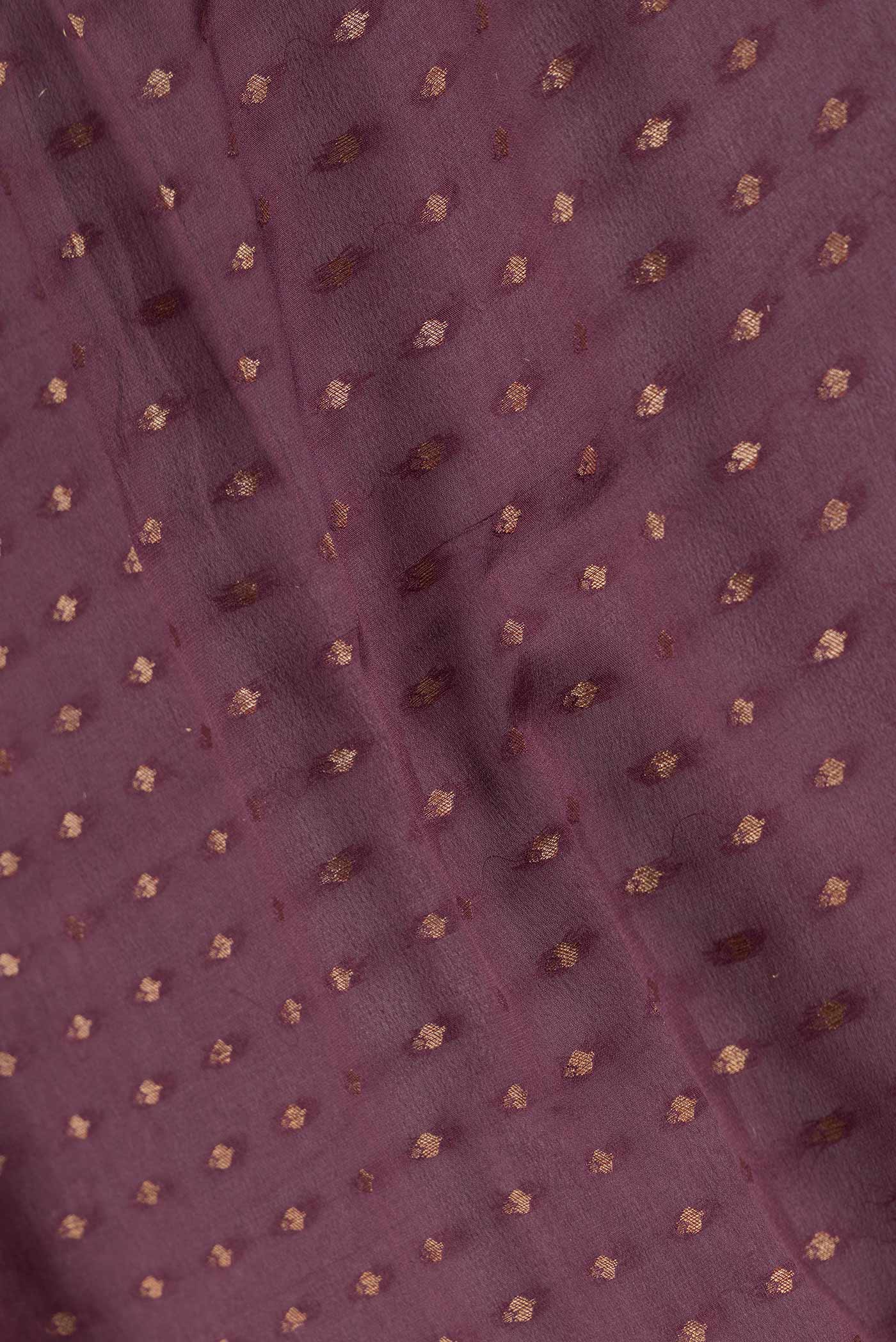 Close up of Brown Dual Tone Banarasi Silk Saree with Zari Butta on the body and Zari Border.  displaying folds