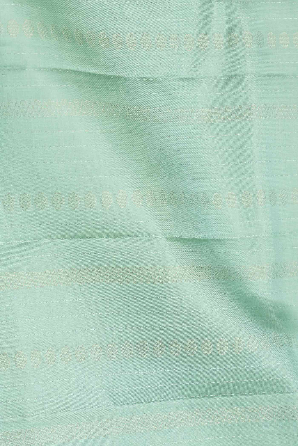 Close up of Pista Green Dual Tone Soft Silk Saree with Stripes on the body and Without Border.  displaying folds
