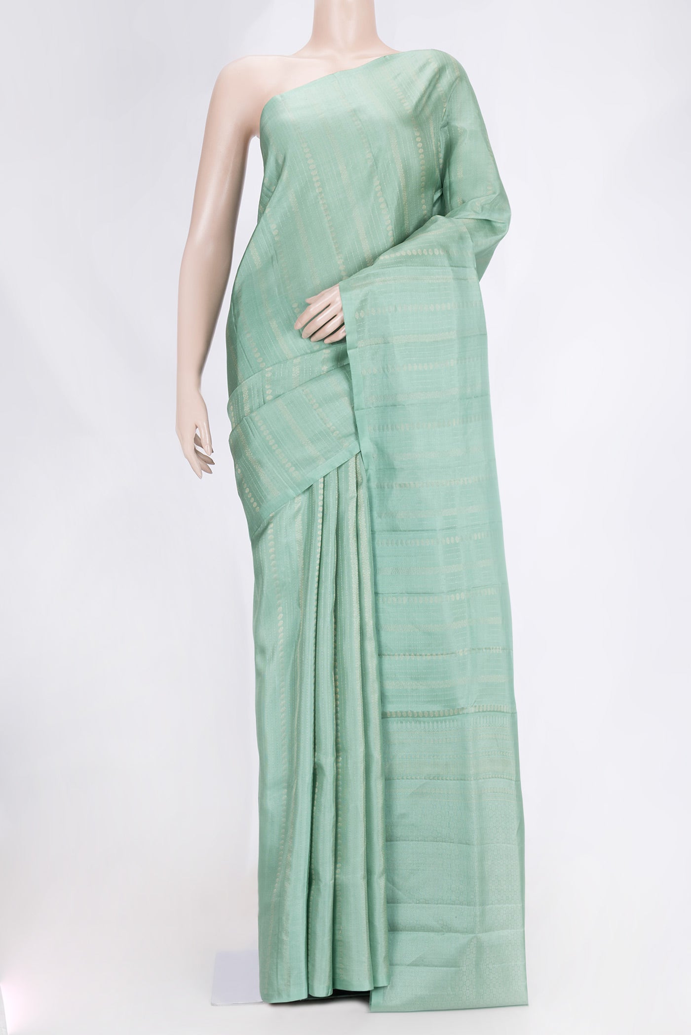 Pista Green Dual Tone Soft Silk Saree with Stripes on the body and Without Border.  displayed on a mannequin