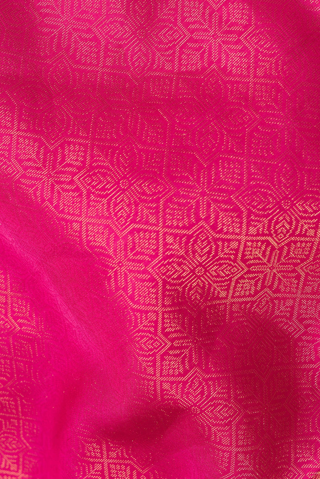 Close up of Pure Silk Dark Pink Soft Saree with Zari Brocade on the body and Fancy Border.  displaying folds