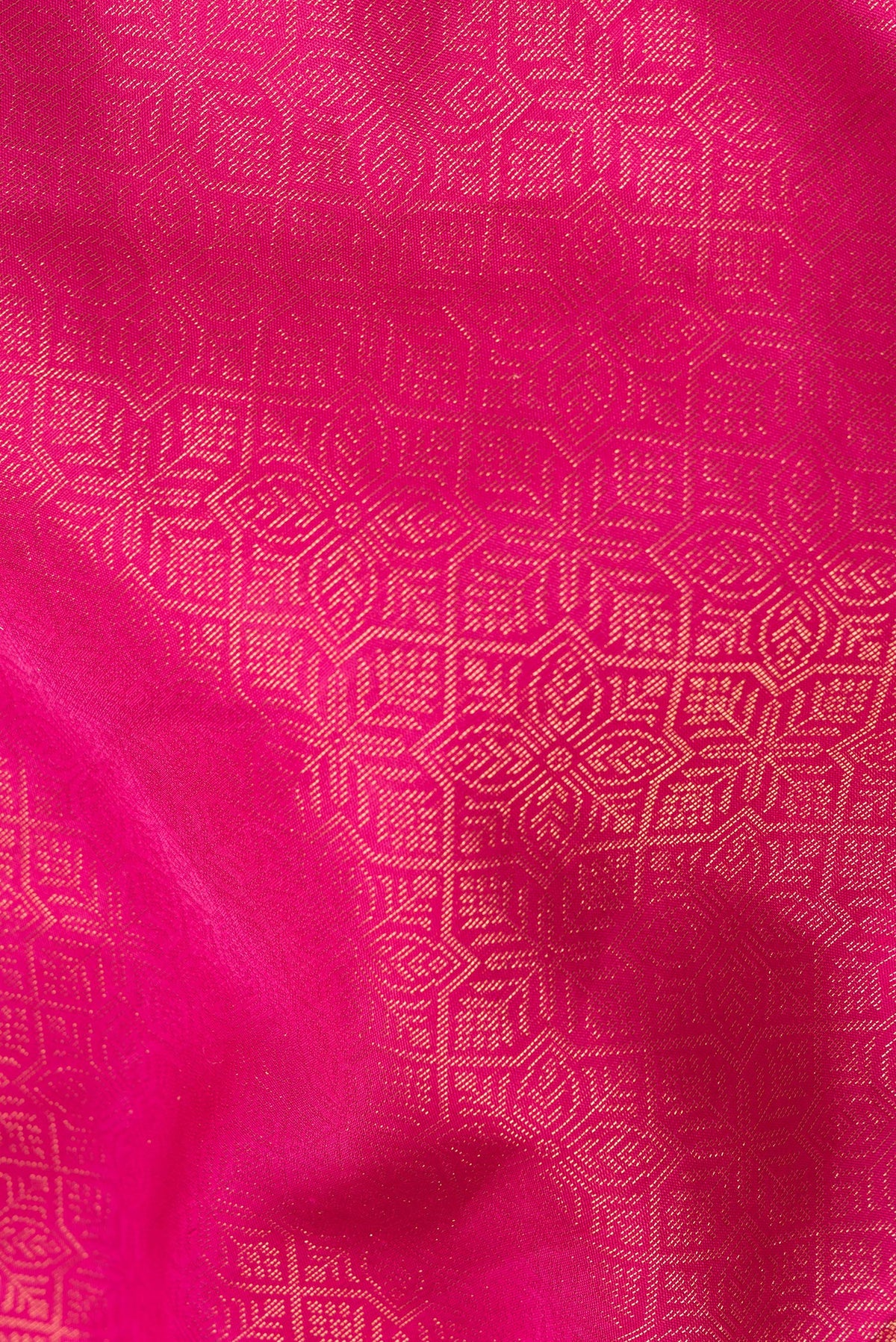 Close up of Pure Silk Dark Pink Soft Saree with Zari Brocade on the body and Fancy Border.  displaying folds