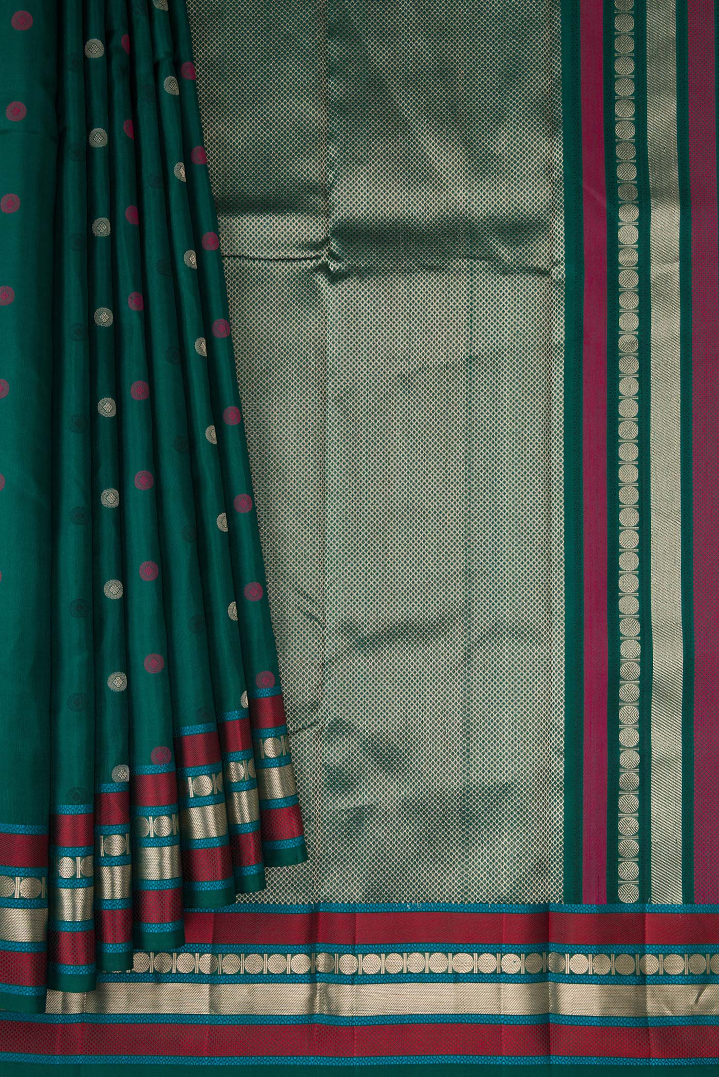 Pleats and pallu of Bottle Green Kanchipuram Silk Saree with Zari And Thread Butta on the body and Zari And Thread Border. 