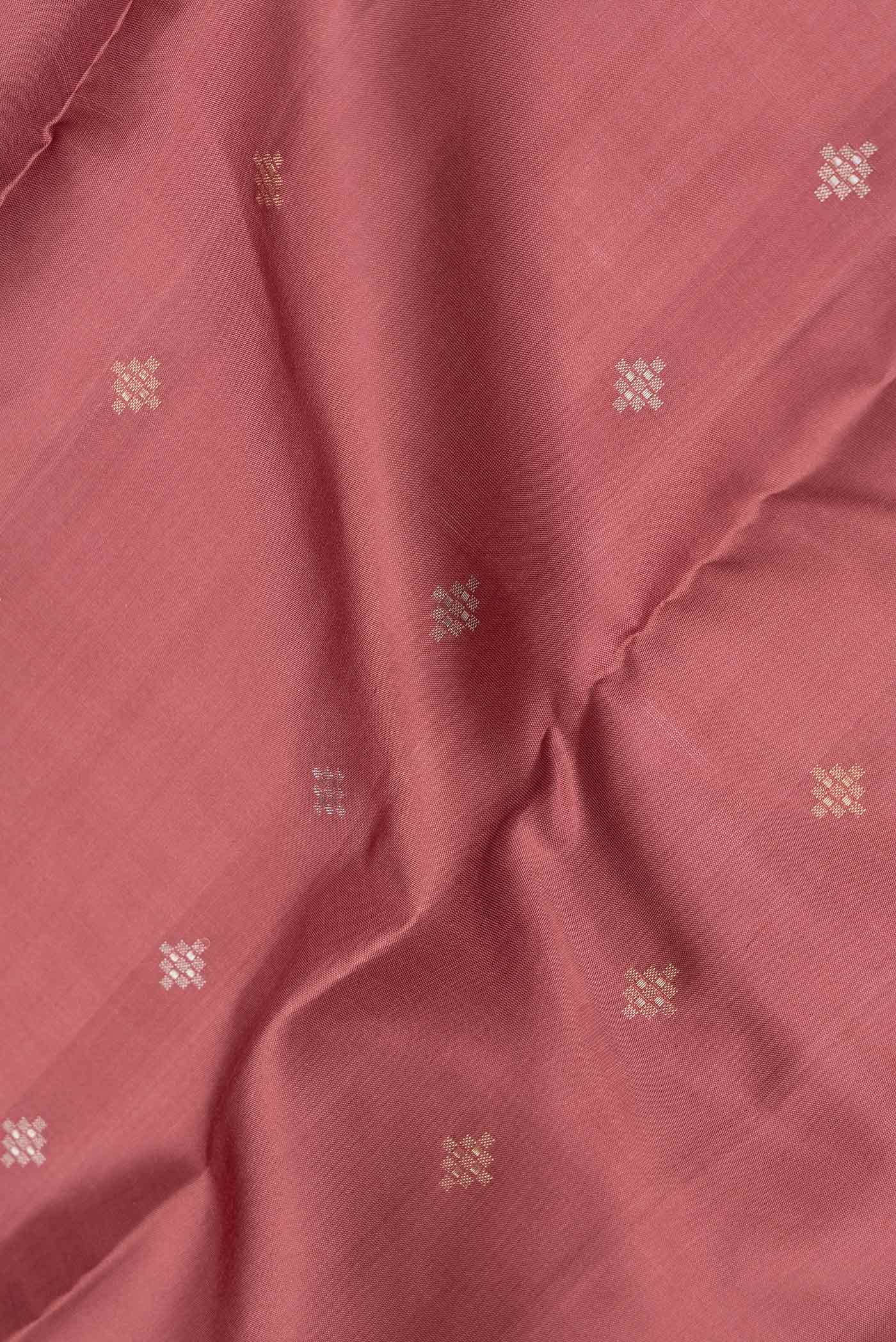 Close up of Brown Dual Tone Kanchipuram Silk Saree with Zari Butta on the body and Zari Border.  displaying folds
