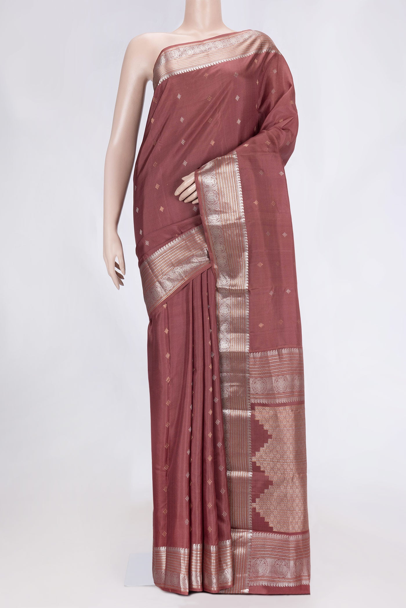 Brown Dual Tone Kanchipuram Silk Saree with Zari Butta on the body and Zari Border.  displayed on a mannequin